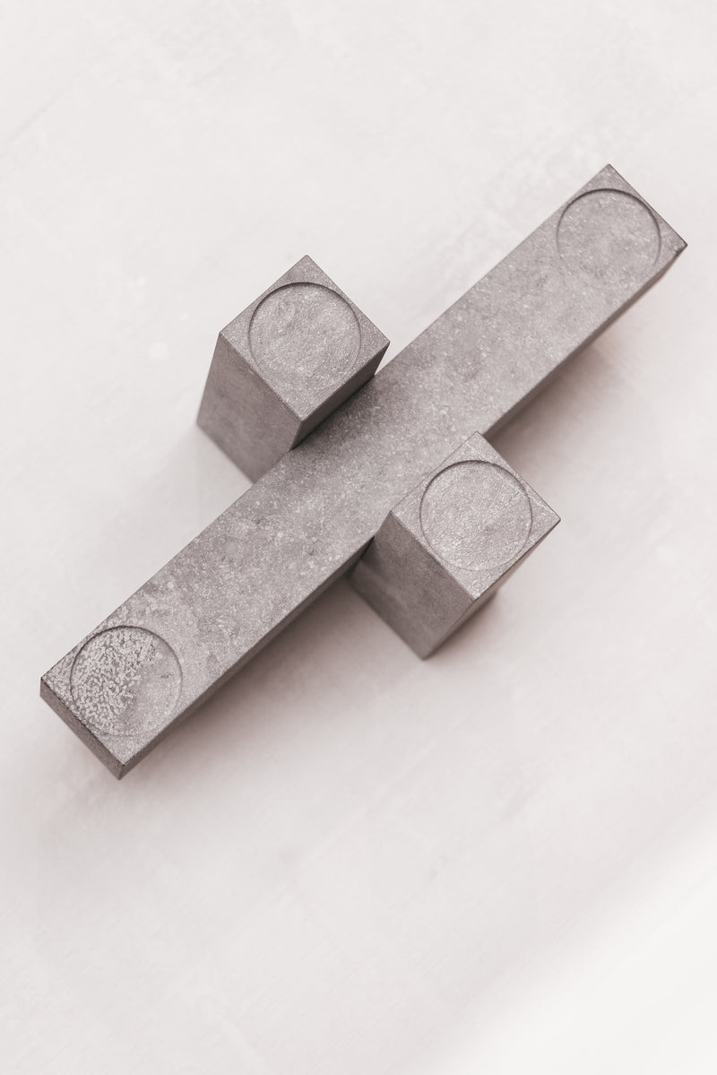 Remembering Carl Andre Candel Holder